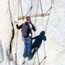 Hiker ascending Half Dome cables