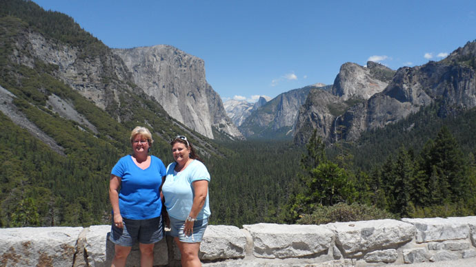Two women standing at Tunnel View