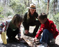 Junior Rangers and NPS Ranger with bear pelt