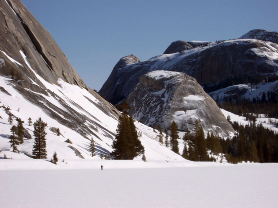 Snow-covered Tenaya Lake with peaks in background
