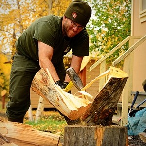Ranger splitting wood