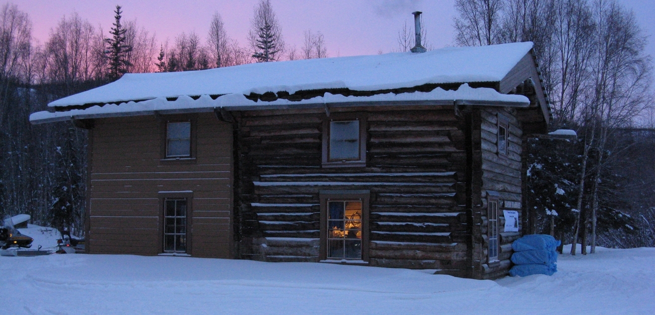 Image of Slaven's Roadhouse with alpenglow in the background.