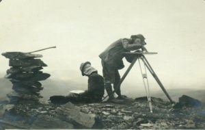 Historic photo of two topographers mapping the international boundary in 1910.