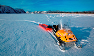 A snowmachine on the Yukon River in winter