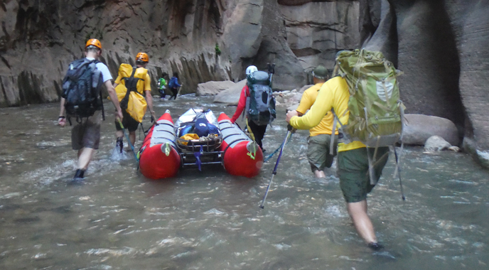 The Search and Rescue team float a patient out of The Narrows in a raft.