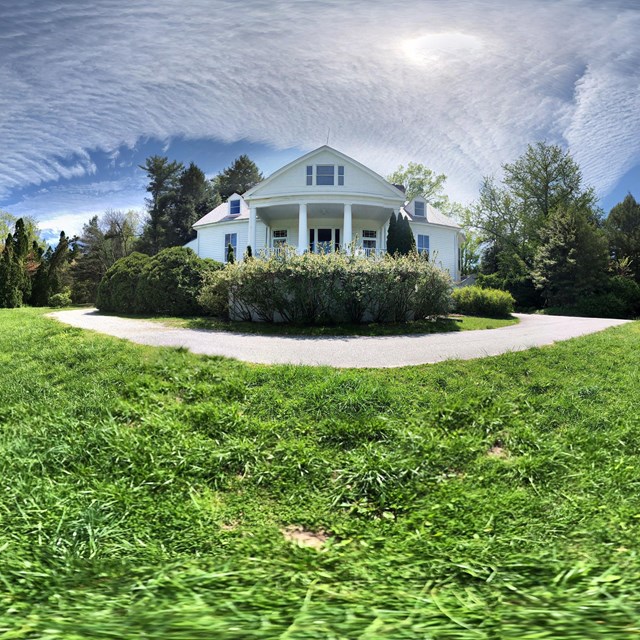 Historic white house on a hilltop