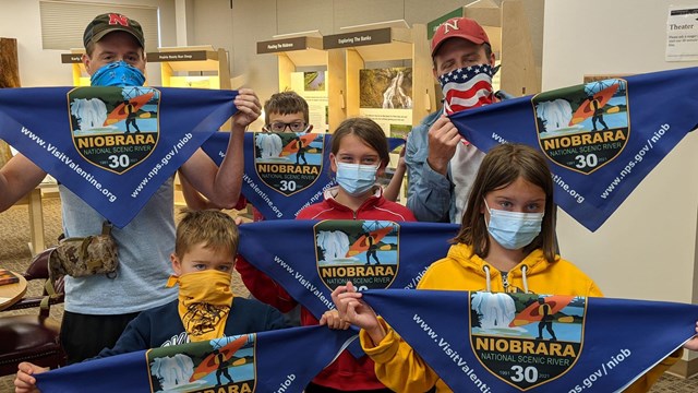 Group of children show off their prize bandanas 