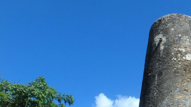 Stone and coral block historic well tower.