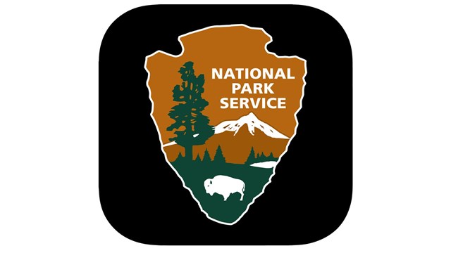 NPS App Icon - NPS Arrowhead logo on a square black background.