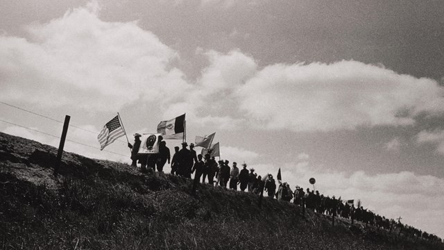 Farm workers and their supporters marching with signs