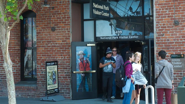 Visitors exit the park visitor center and exhibit.