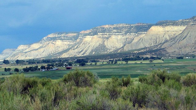 View of archeological site with neighboring farms in the background