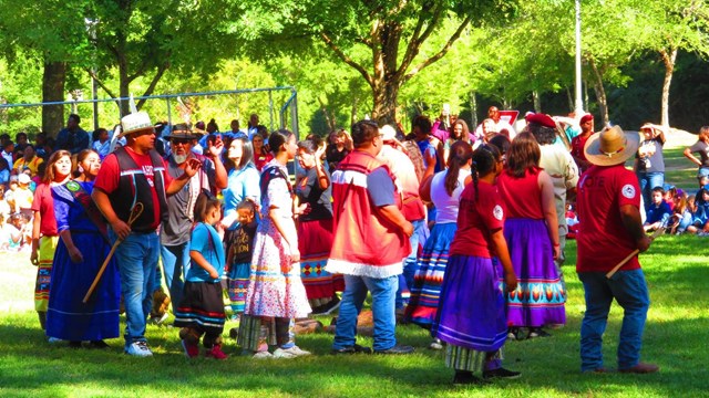 Participants dancing in a circle