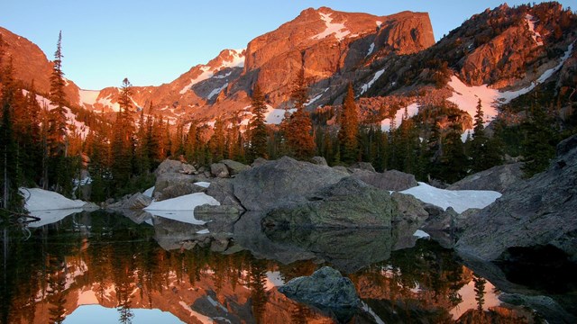 Hallet's Peak reflected in Lake Haiyaha at dawn in Rocky Mountain NP.Credit:NPS/Debra Miller