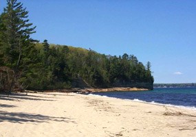 Miners Beach extends for one mile on Lake Superior where waves roll in to polish beach cobbles. 