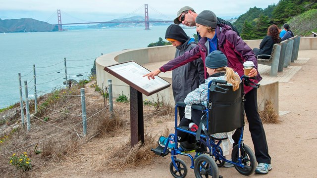 Park visitor using wheelchair accessible trail at Land's End