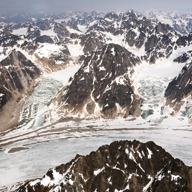 Ragged peaks as far as the eye can see are covered in snow and ice.