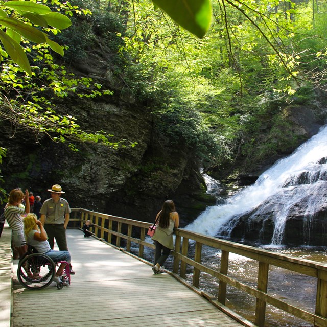 Visitors speak with a park ranger at Dingmans Falls