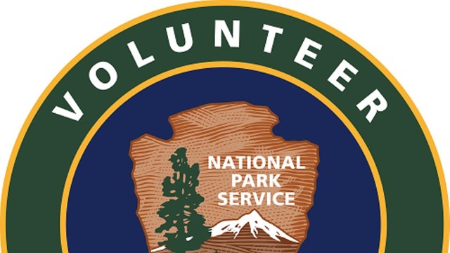 Volunteer logo with National Park Service Arrowhead in the center 