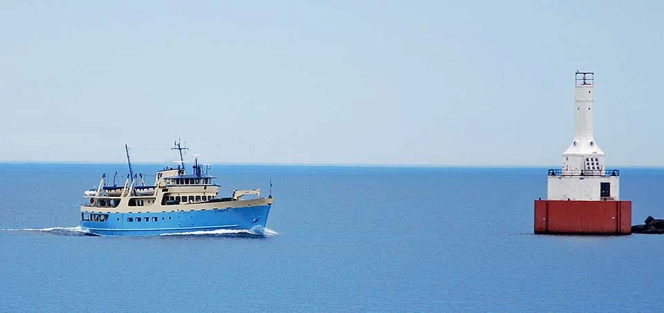 ranger iii ferry water the blue Ranger III ferry boat on left approaching red buoy in right