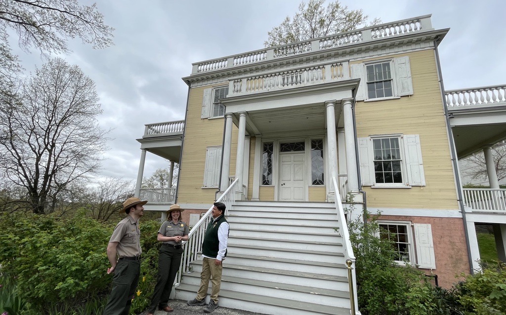National Park Service Director Chuck Sams visits with uniformed national park rangers at Hamilton Grange National Memorial located in New York City's Harlem neighborhood. National Park Service Director Chuck Sams visits with uniformed national park rangers at Hamilton Grange National Memorial in Harlem.
