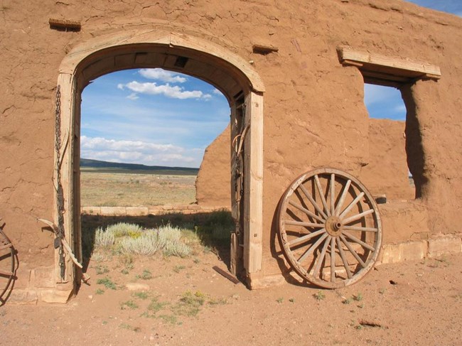 Mechanics Corral Machine Shop Door at Fort Union National Monument arched open doorway in wall looking across prairie
