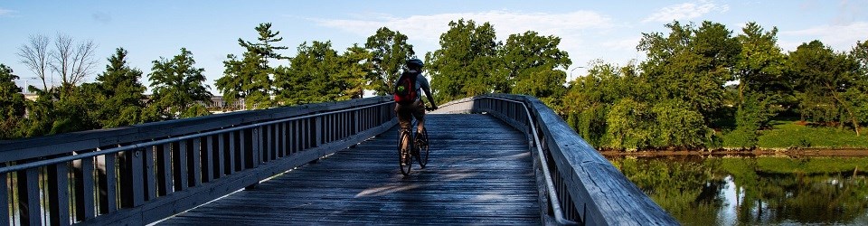 LYBA Boundary Channel Bridge Bicyclist riding across a bridge over a channel