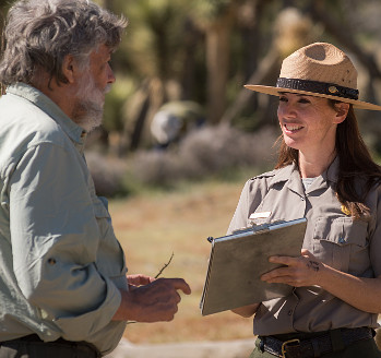 Park ranger talking to visitor Park ranger talking to visitor