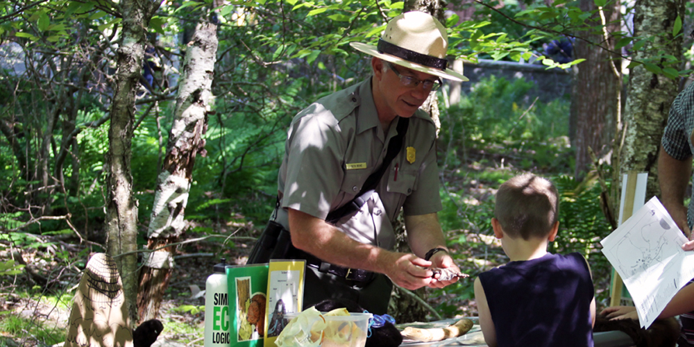 A Park Ranger talks about beavers during the 2011 Family Fun Day, held annually at Sieur de Monts Spring.