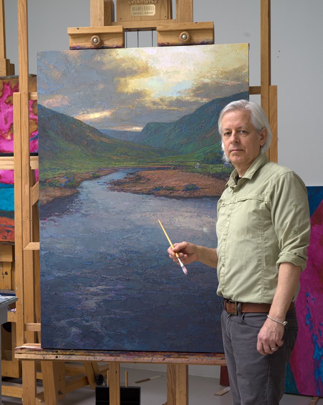 Photograph of artist Thomas Paquette in his studio