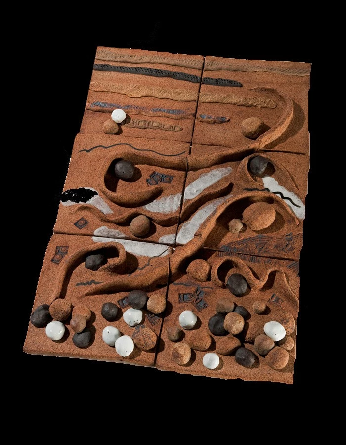 "Don't Pick up the Rocks" Abstract sculpture made of clay representing waves and rocks.