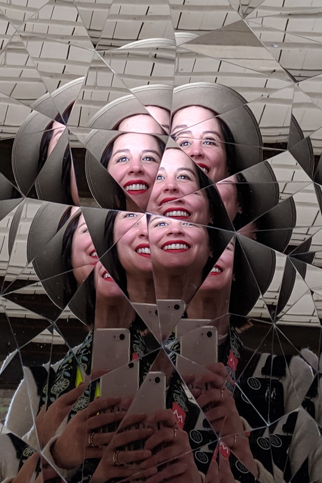 Fractured collage of images making a portrait of a smiling woman