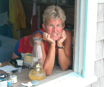 Sally Gierke Artist Sally Gierke in window.