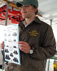 volunteer holding boat chart volunteer holding boat chart