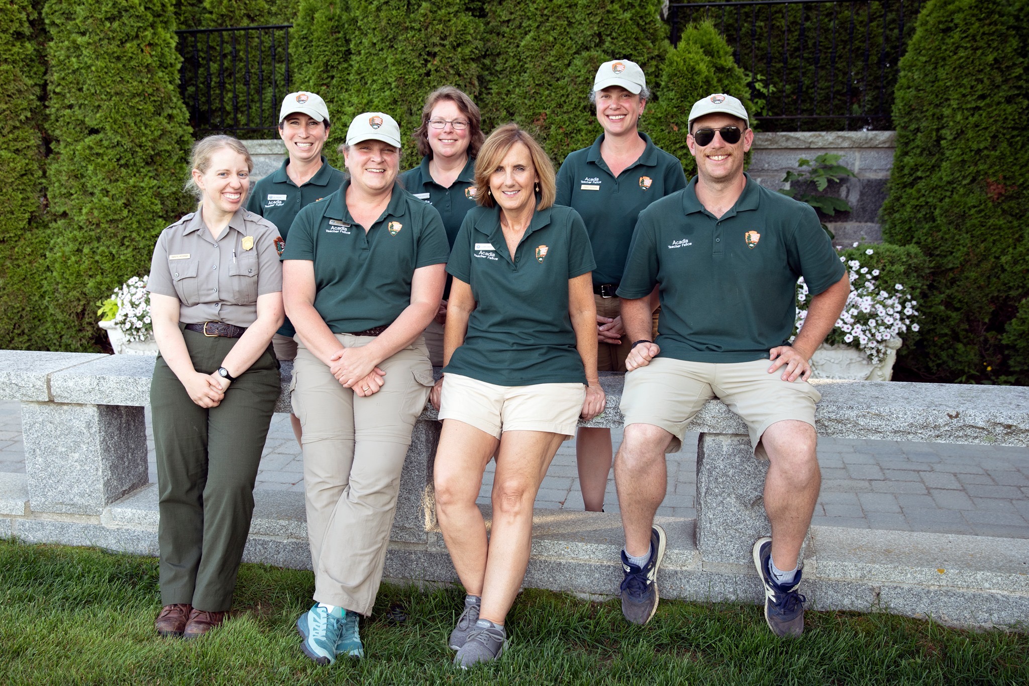 Teachers and ranger posed in front of camera