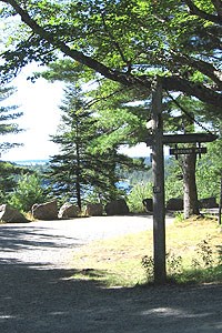 A signpost marks a carriage road intersection. A signpost marks a carriage road intersection.