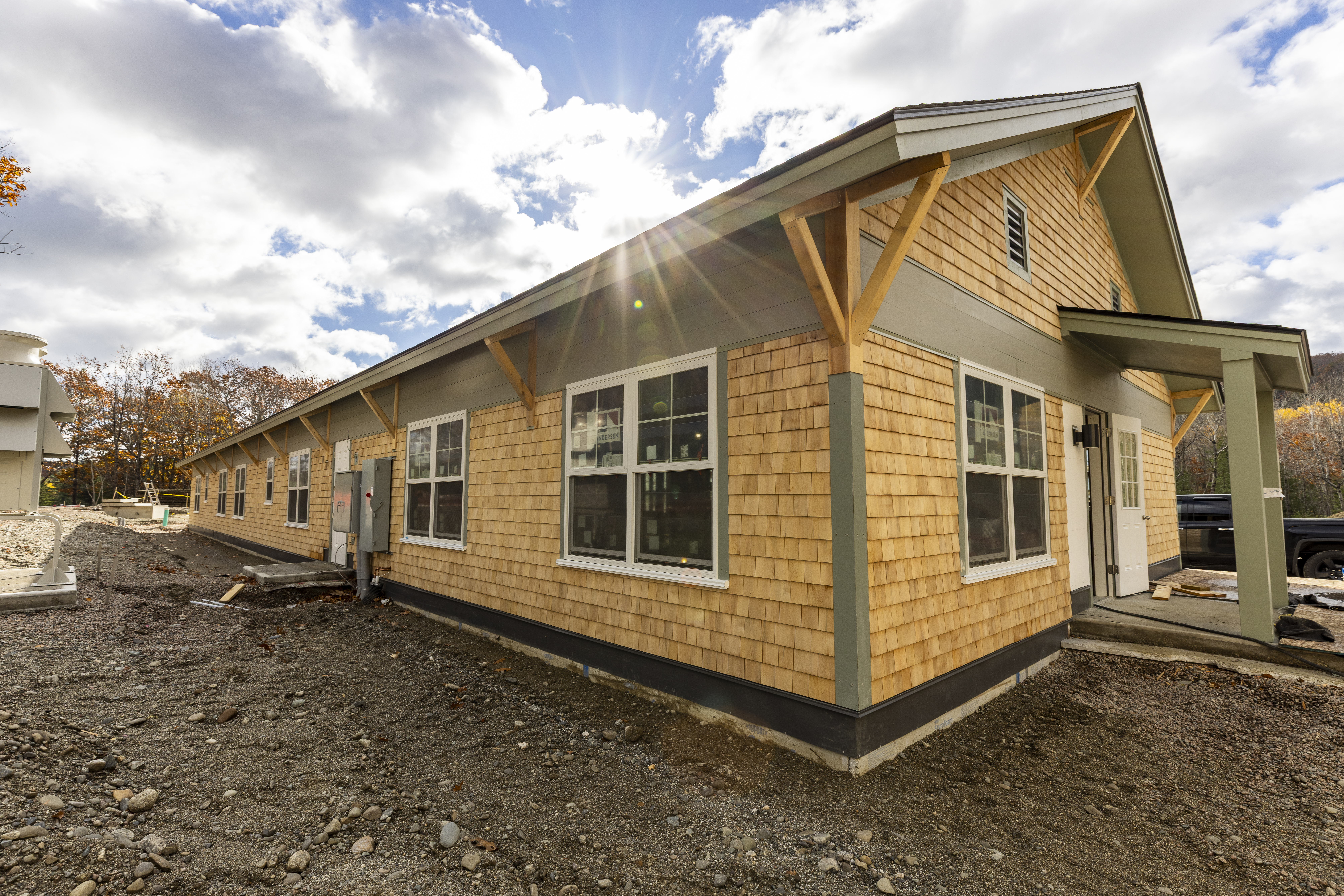 Newly constructed single story building with a gabled roof.