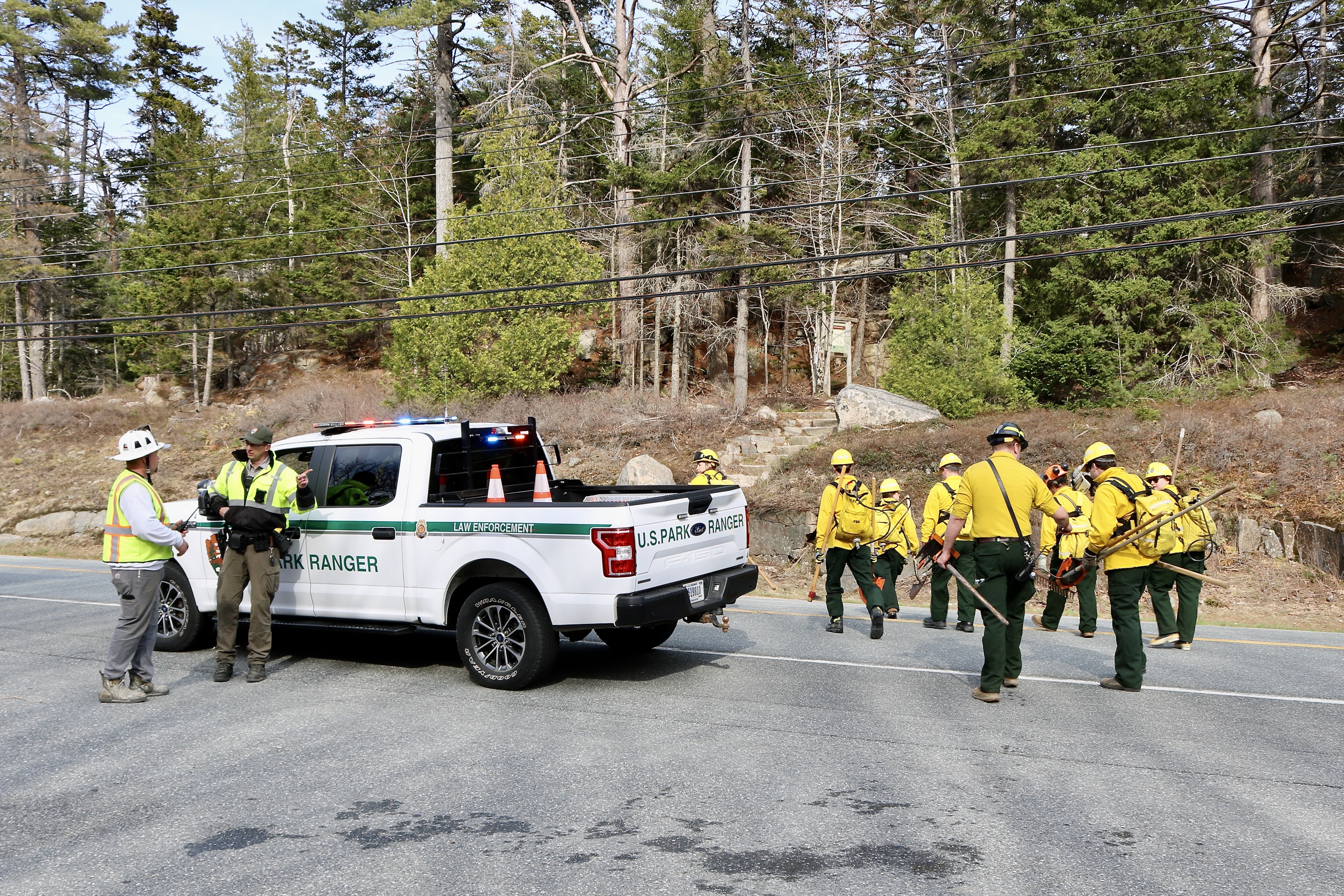 Park rangers and other responders start on St. Sauveur Trail.