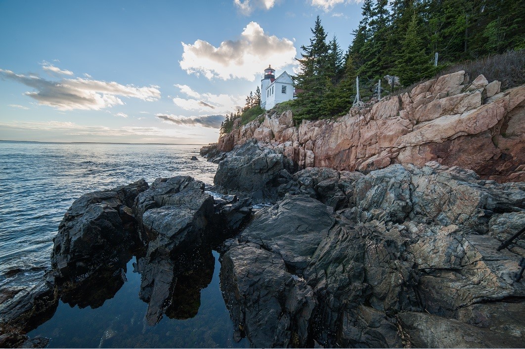 Lighthouse on rocky coastline Lighthouse on rocky coastline