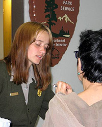 Ranger talking to visitor at desk