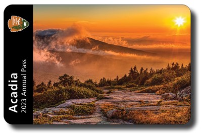 Mock up of 2023 Acadia Annual Pass featuring an image of sunrise
