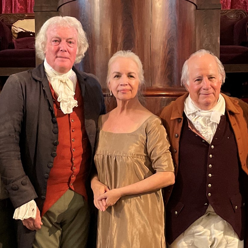 Bill Barker, Abigail Schumann, and Sam Goodyear as Thomas Jefferson, Abigail Adams, and John Adams Two men and one woman wearing clothing in the style of the late 1700s and early 1800s