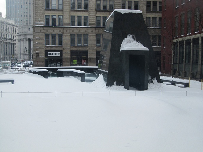 The outdoor memorial after a snowfall.