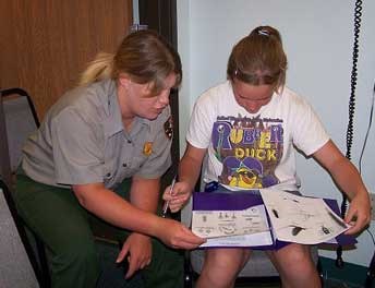 Ranger helping students in classroom. Ranger helping students in classroom.