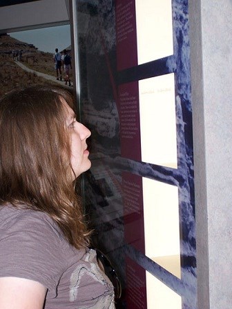 Reading an indoor exhibit. Reading an indoor exhibit.