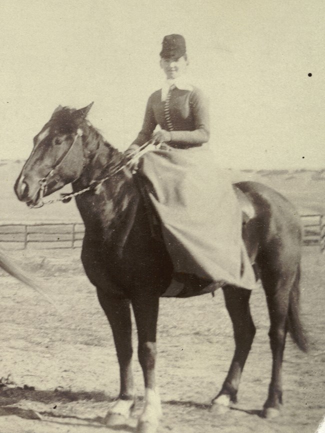 Kate Graham on a horse at the ranch.