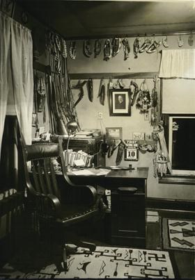 The Cook Collection of Plains Indian artifacts made of leather, colorful beads, and porcupine quills hangs in James Cook's den at the Agate Springs Ranch.