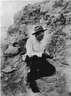 James Cook looking at a fossil. James Cook looking at a fossil.
