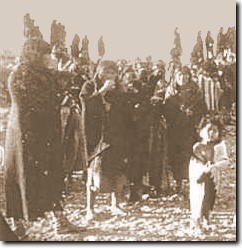 Hopi crowd including children watching in suspense.