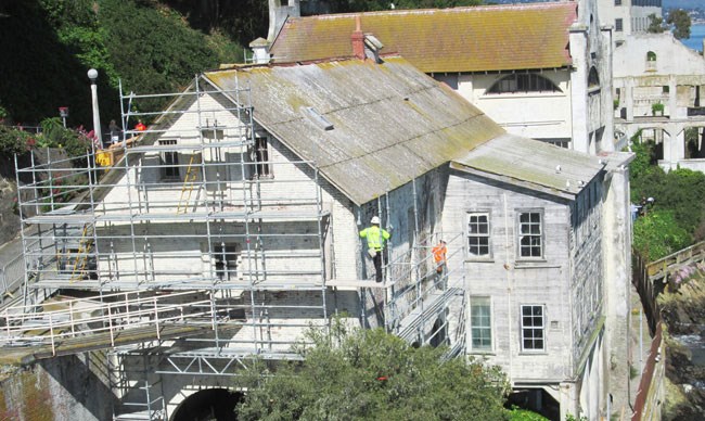 men on scaffolding around building men on scaffolding around building